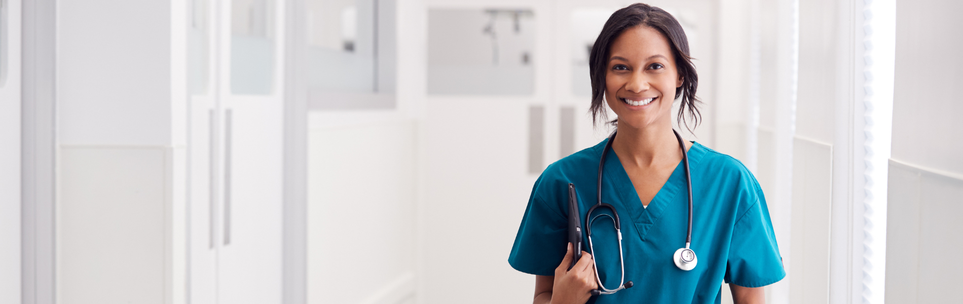 Per Diem Nurse smiling while holding a clipboard