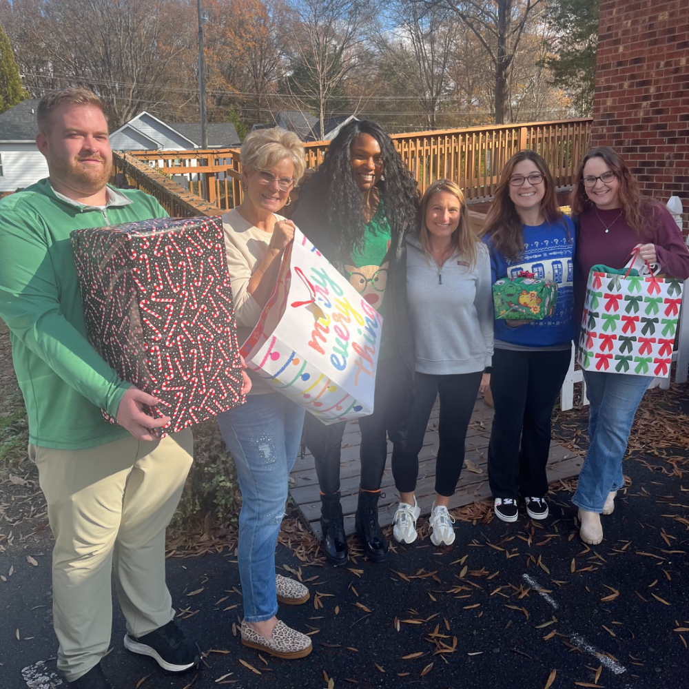 Charlotte team donating their gifts